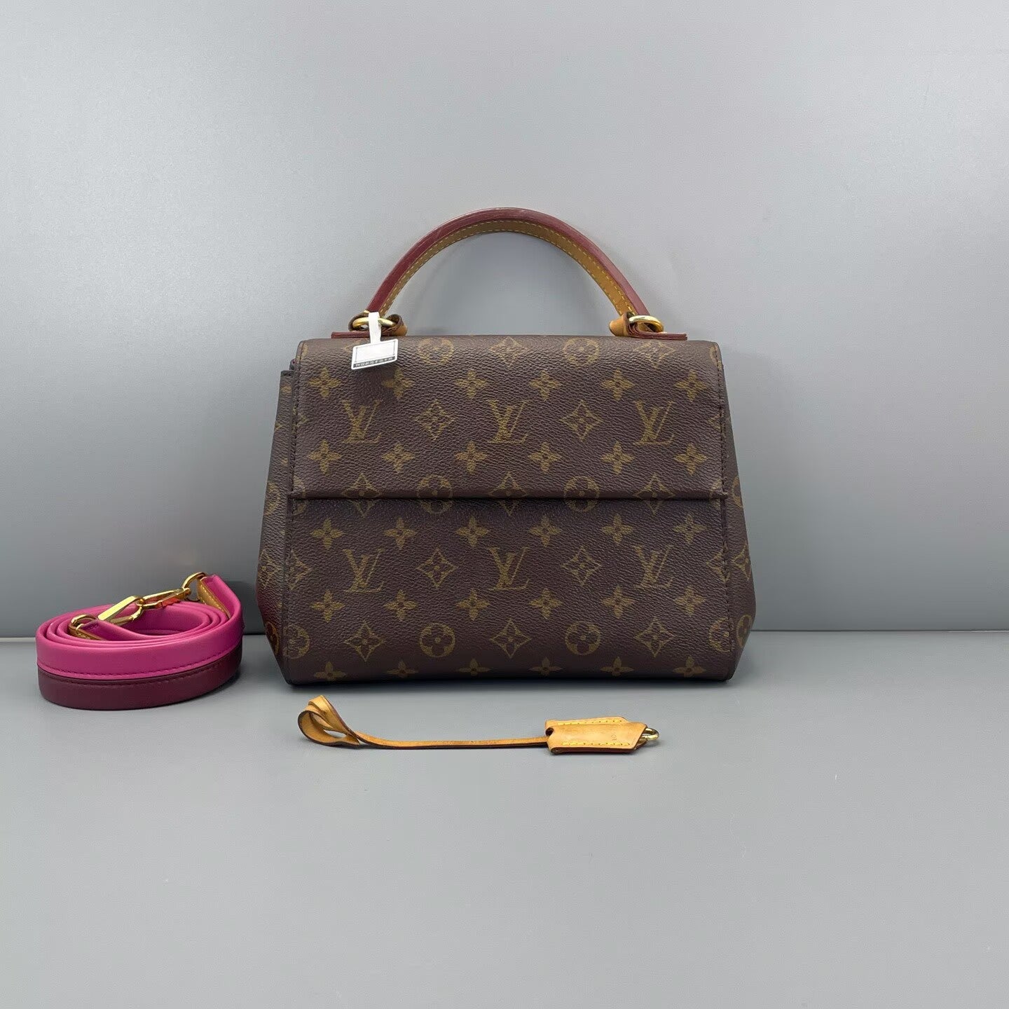 Louis Vuitton - Cluny BB - Monogram coated canvas with leather trim - Brown with pink interior and strap accents - (Small)