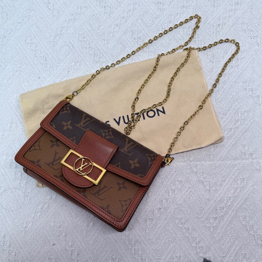 Louis Vuitton - Dauphine WOC - Monogram coated canvas with leather trim - Brown - (mini)