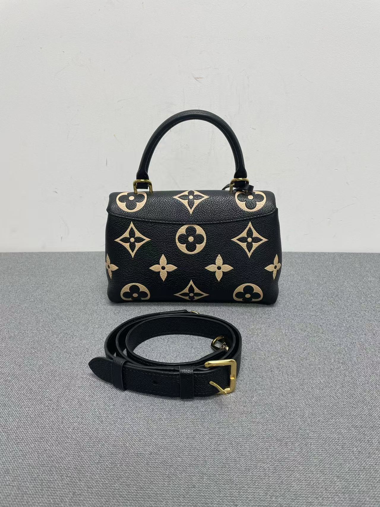 Louis Vuitton - Madeleine Small - Grained leather - Black with Beige motifs and Red interior - (Small)