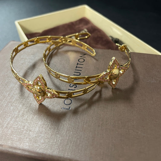 Louis Vuitton - Other - Gold-tone metal with pink crystal embellishments; alloy composition unspecified. - Gold