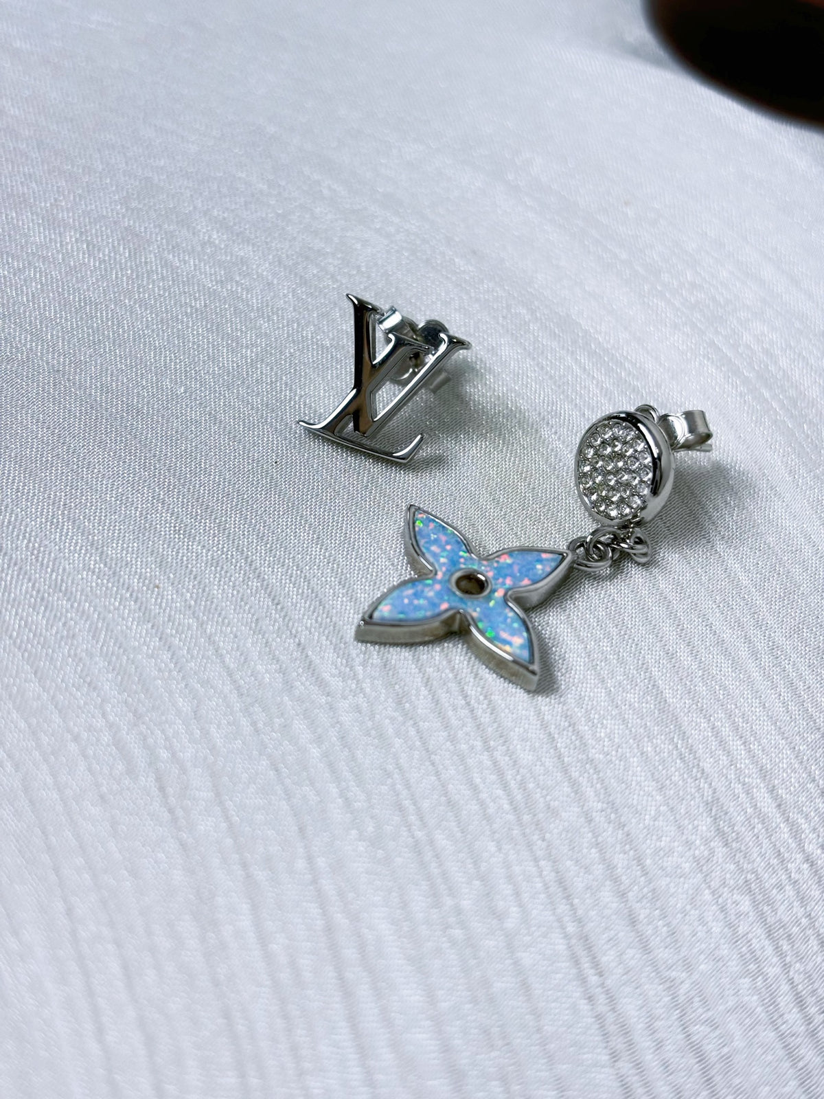 Louis Vuitton - Other - Silver-tone metal with clear crystal-like accents and blue iridescent inlay; exact composition of the accents and inlay is unconfirmed. - Multicolour