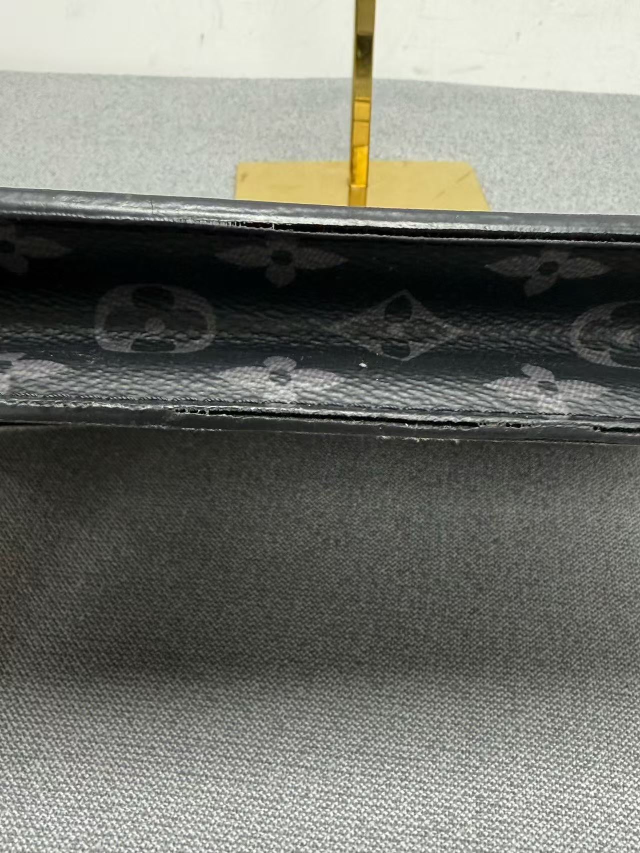 Louis Vuitton - Pochette Voyage - Monogram Eclipse coated canvas with leather trim - Grey - (medium)