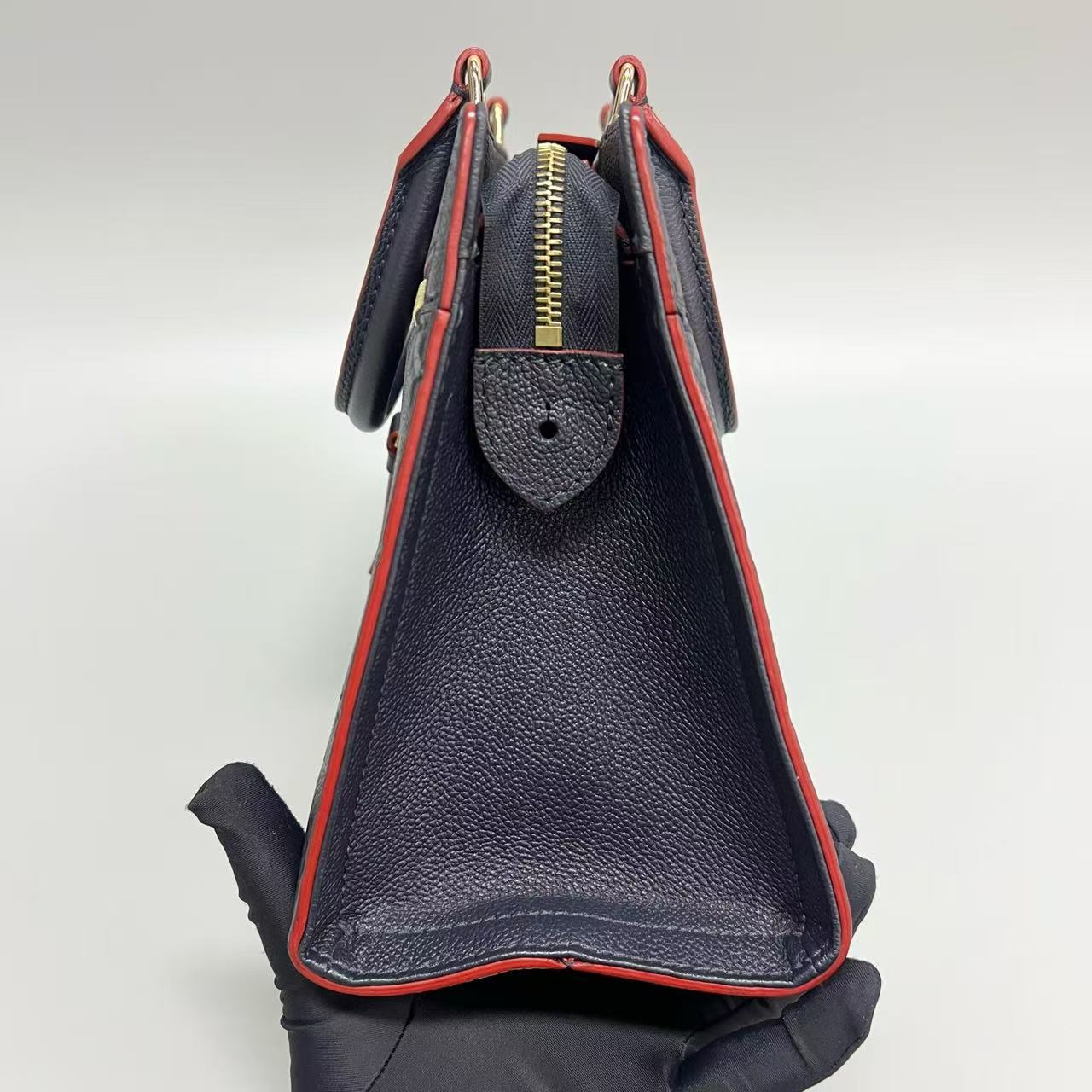 Louis Vuitton - Sully - Monogram Empreinte leather - Navy with Red Glazing - (medium)