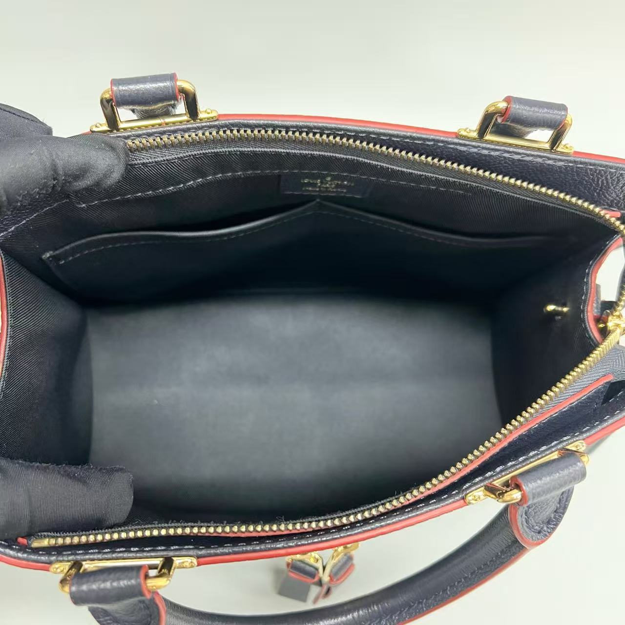 Louis Vuitton - Sully - Monogram Empreinte leather - Navy with Red Glazing - (medium)