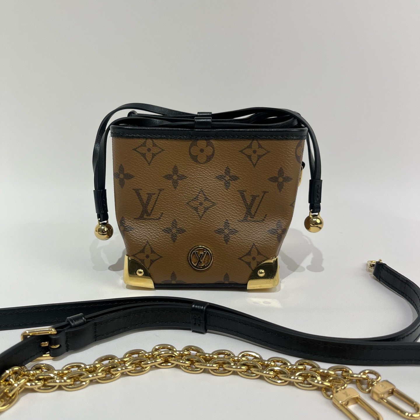 Louis Vuitton - Trunk-inspired Drawstring Pouch - Coated canvas with leather trim - Brown - (mini)