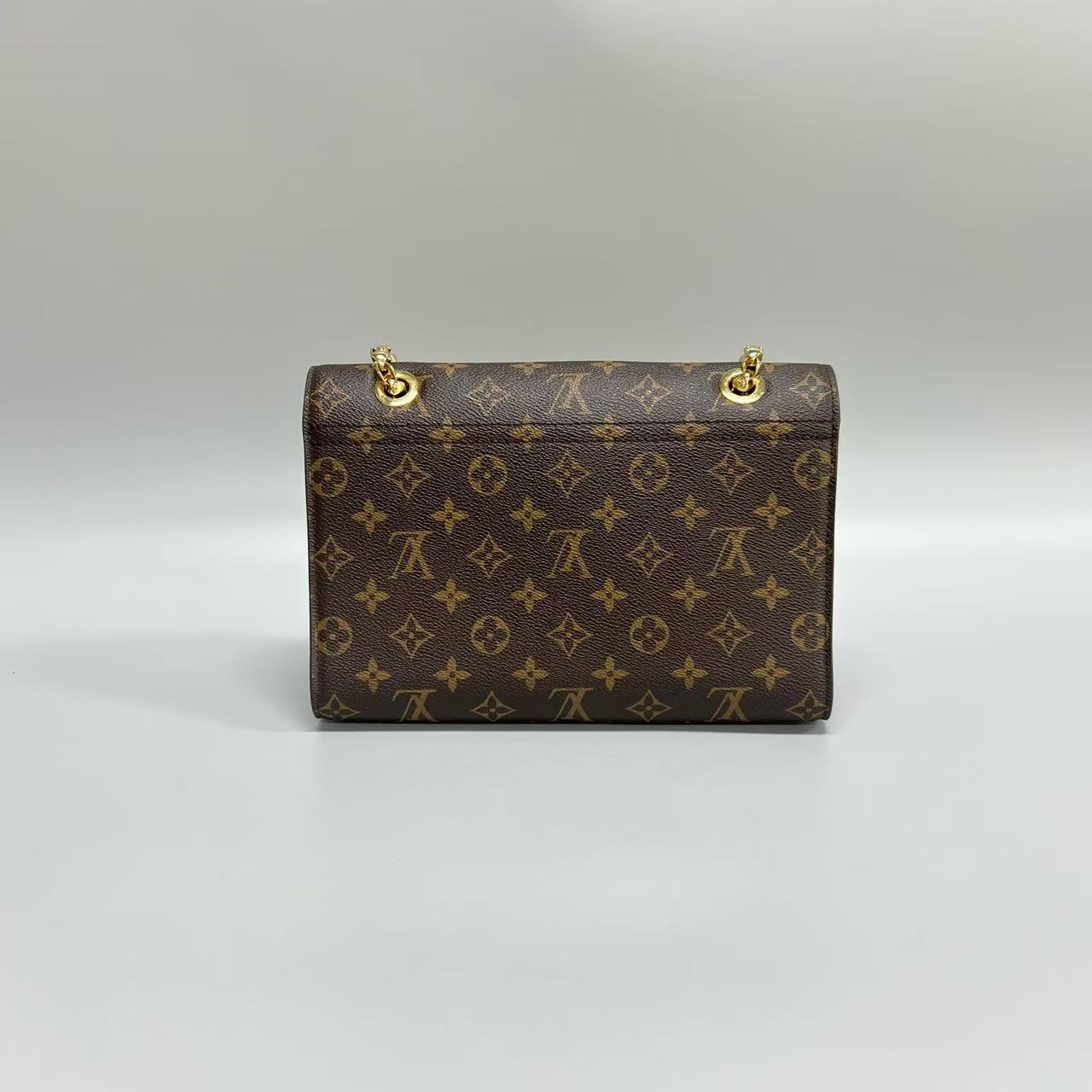 Louis Vuitton - Victoire - Monogram coated canvas and grained leather - Brown and Red - (medium)