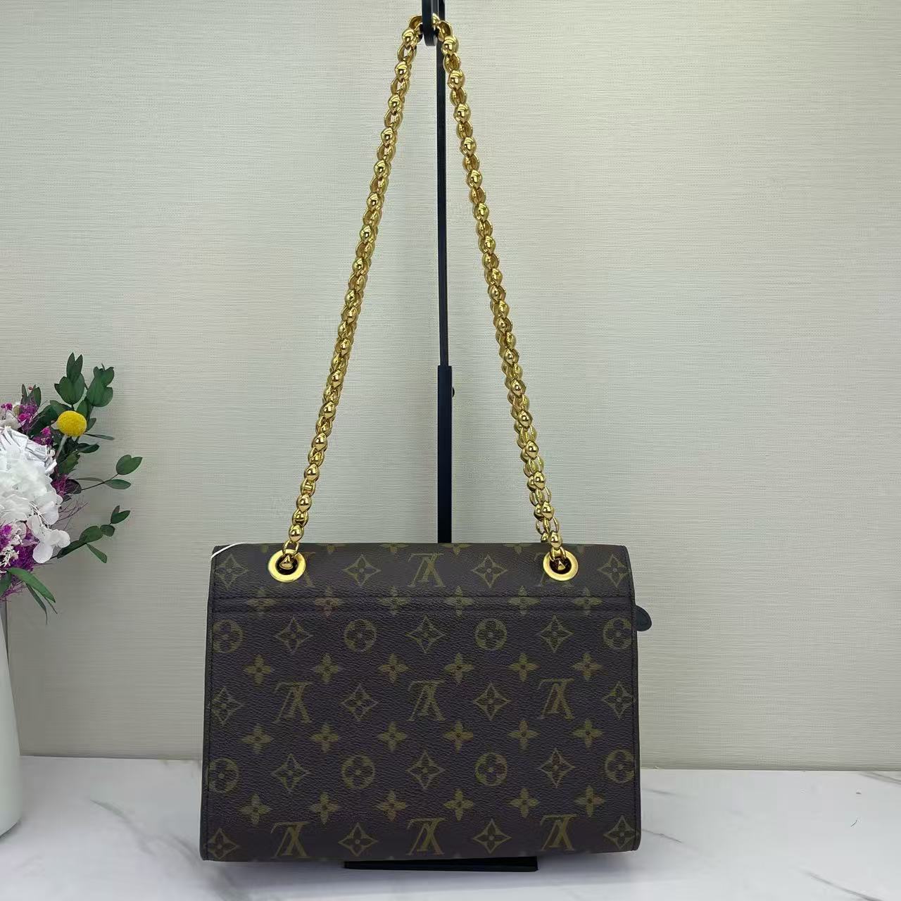 Louis Vuitton - Victoire - Monogram coated canvas with grained leather trim - Brown and Black with Gold-Tone Hardware - (medium)