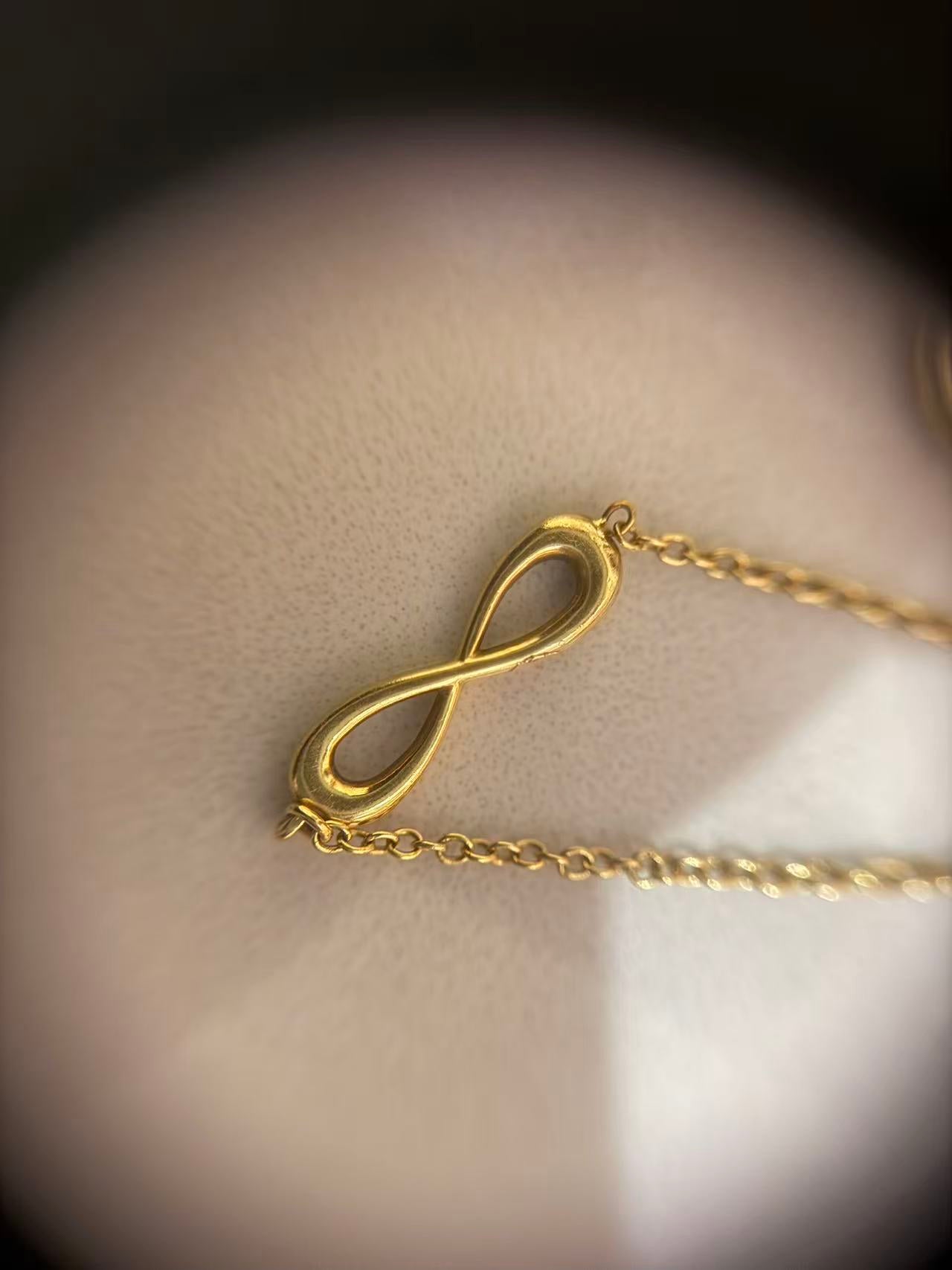 Tiffany & Co - Infinity - Yellow gold - Gold