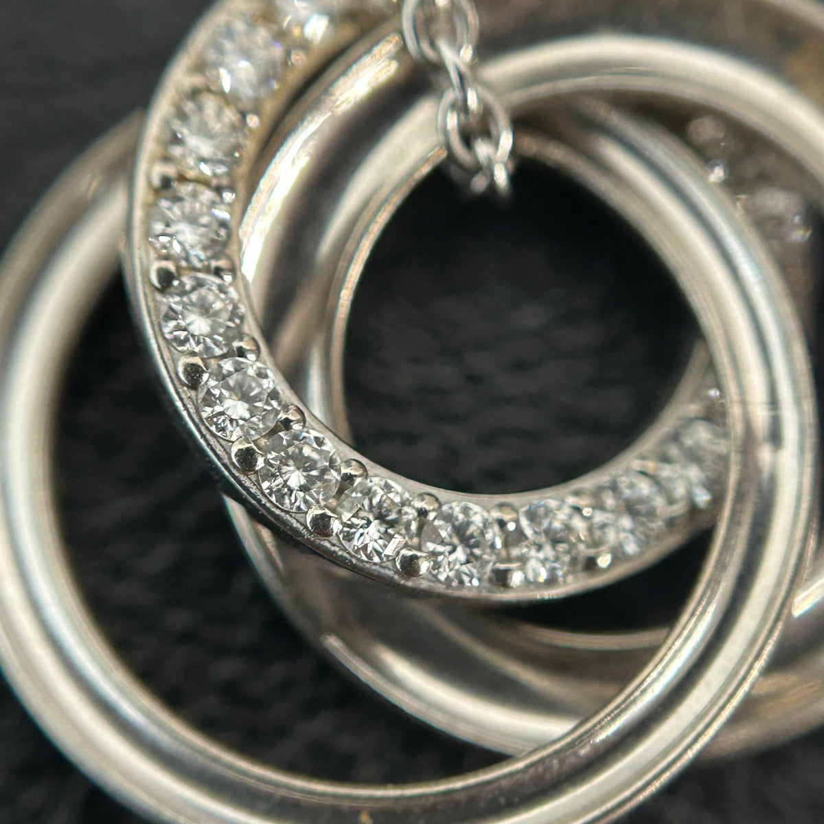 Tiffany & Co. - Interlocking Circles - Sterling silver; the pendant appears to bear a 925 hallmark. One circle is set with pave diamonds. - Silver