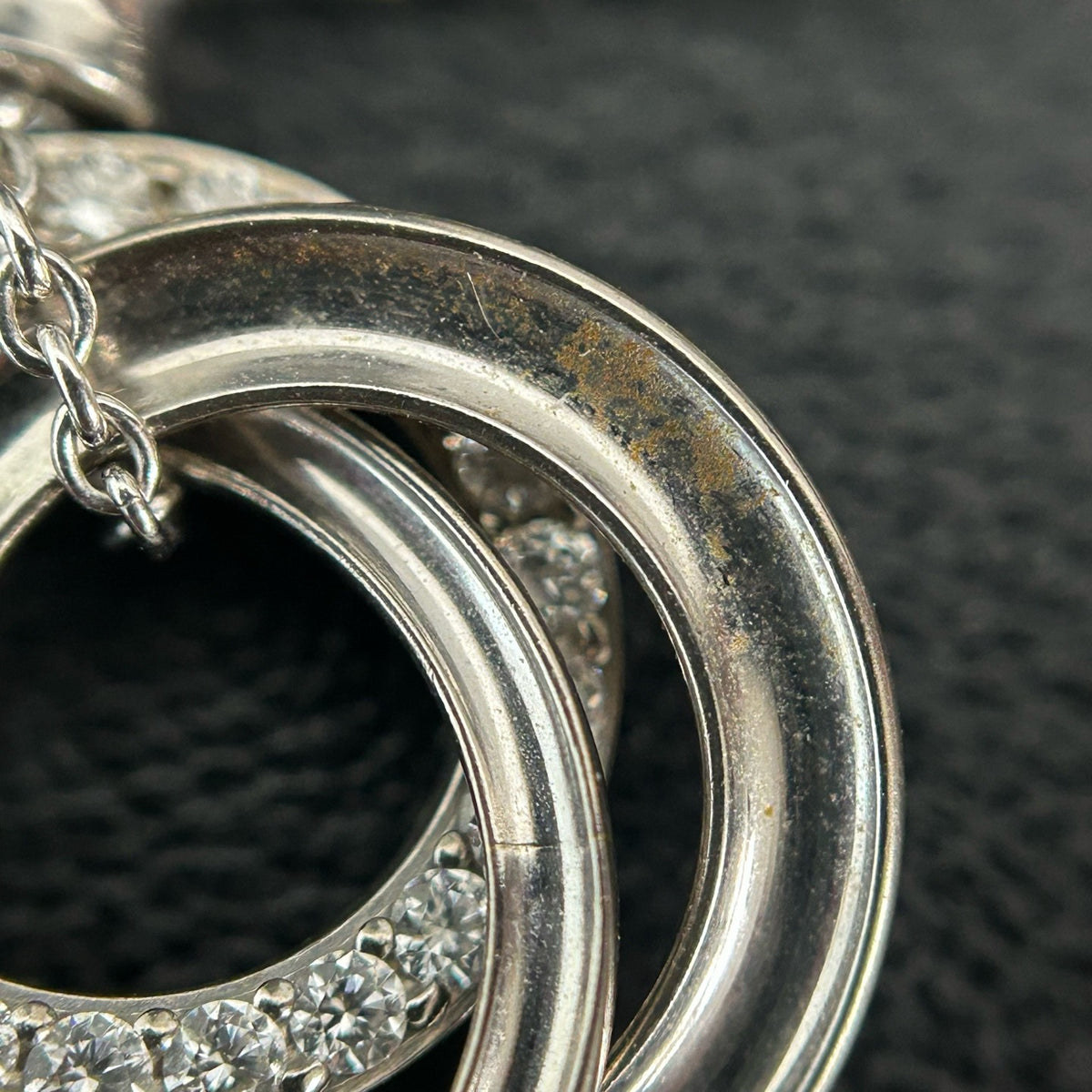 Tiffany & Co. - Interlocking Circles - Sterling silver; the pendant appears to bear a 925 hallmark. One circle is set with pave diamonds. - Silver