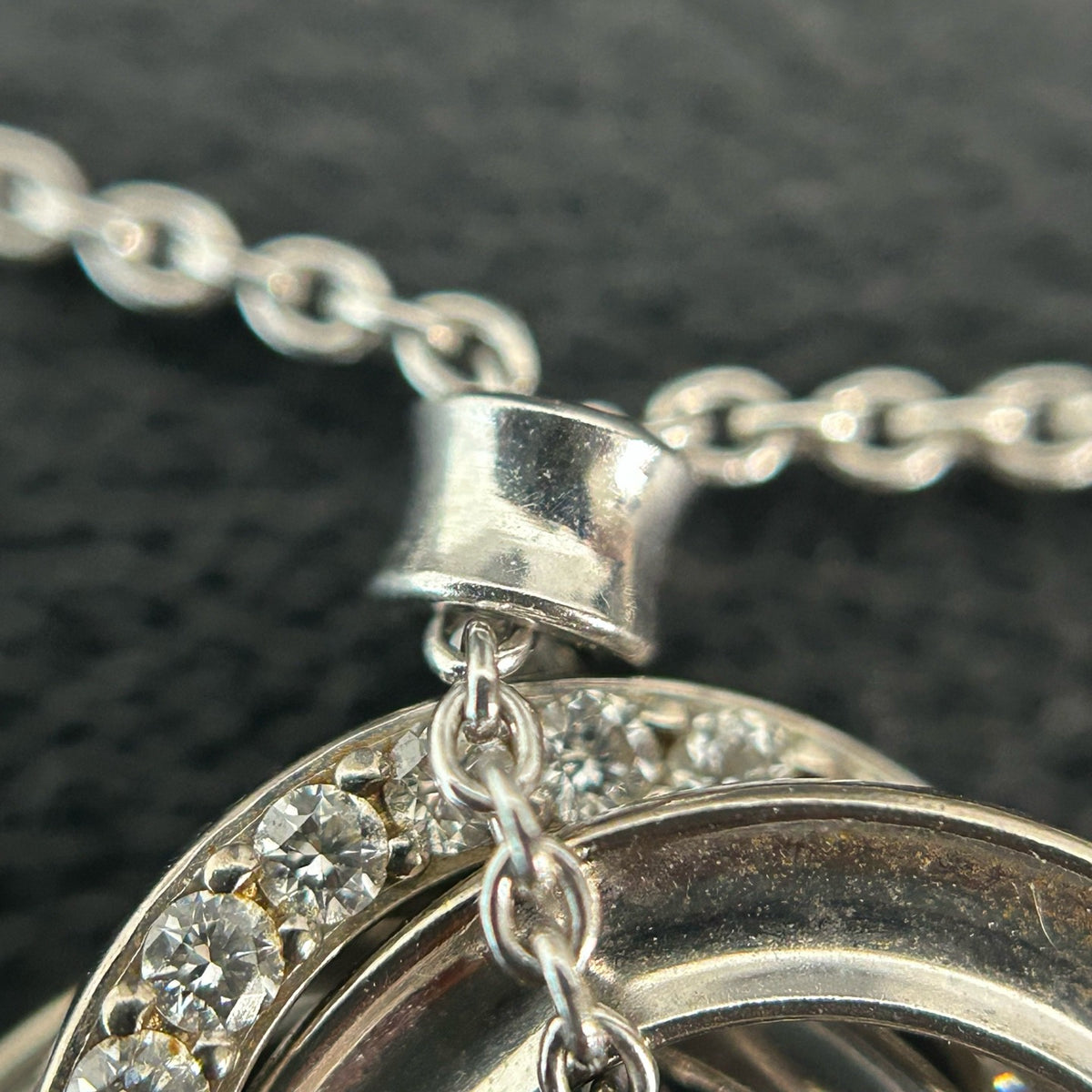Tiffany & Co. - Interlocking Circles - Sterling silver; the pendant appears to bear a 925 hallmark. One circle is set with pave diamonds. - Silver