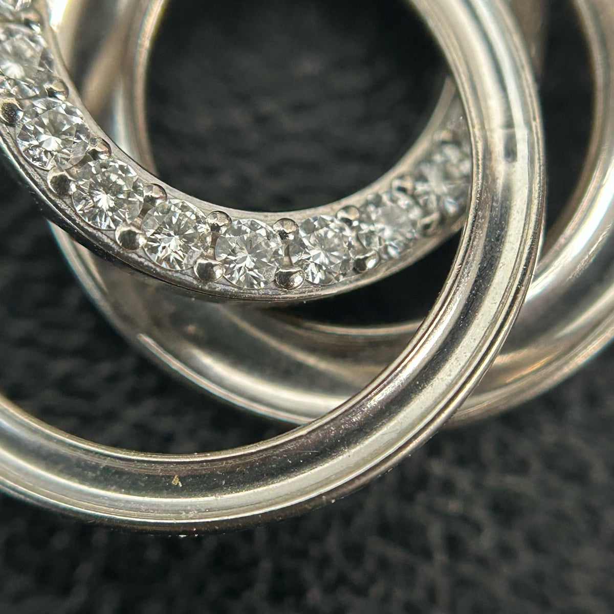 Tiffany & Co. - Interlocking Circles - Sterling silver; the pendant appears to bear a 925 hallmark. One circle is set with pave diamonds. - Silver
