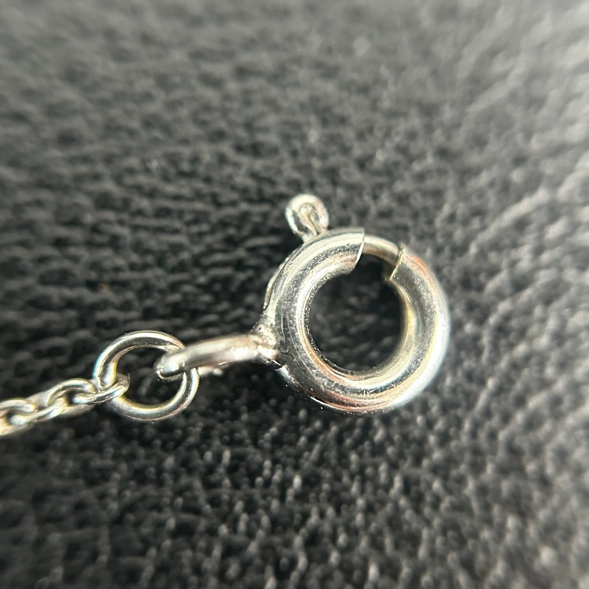 Tiffany & Co. - Interlocking Circles - Sterling silver; the pendant appears to bear a 925 hallmark. One circle is set with pave diamonds. - Silver