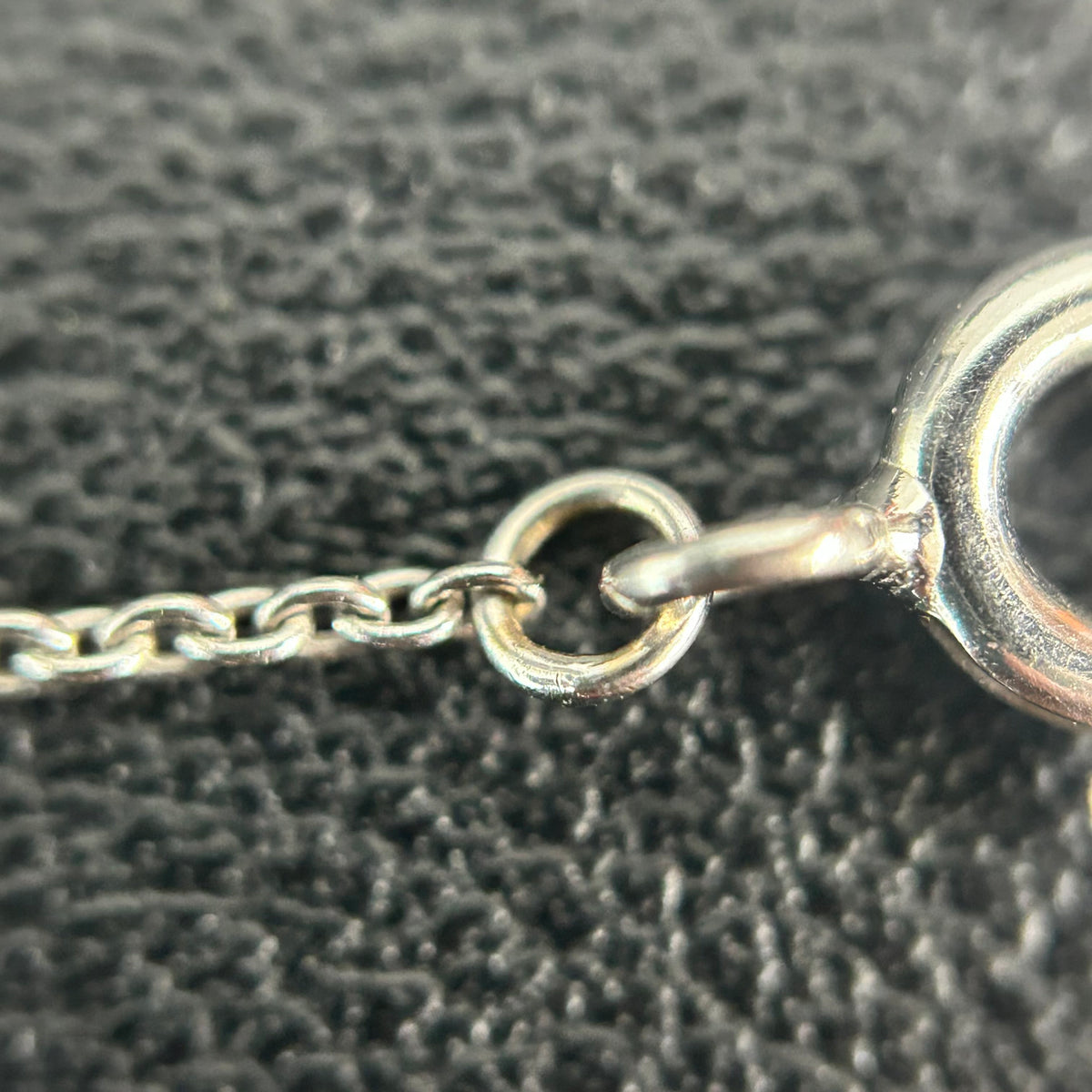Tiffany & Co. - Interlocking Circles - Sterling silver; the pendant appears to bear a 925 hallmark. One circle is set with pave diamonds. - Silver