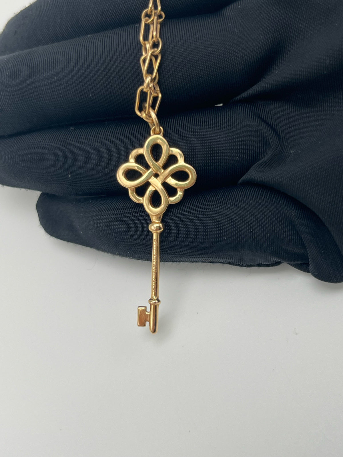 Tiffany & Co. - Keys Bow Key Pendant - 18K rose gold with diamond accents. - Gold